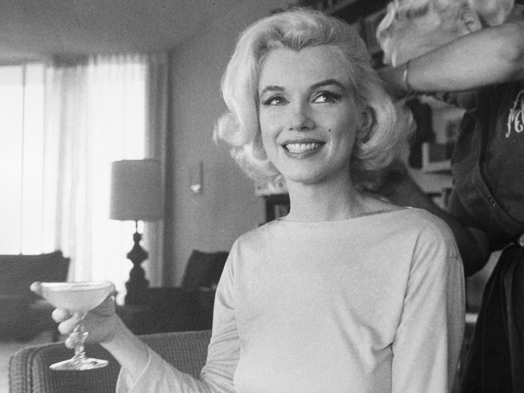 Marilyn Monroe with a glass of champagne