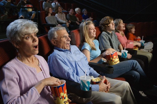 People Watching Movie in Movie Theatre