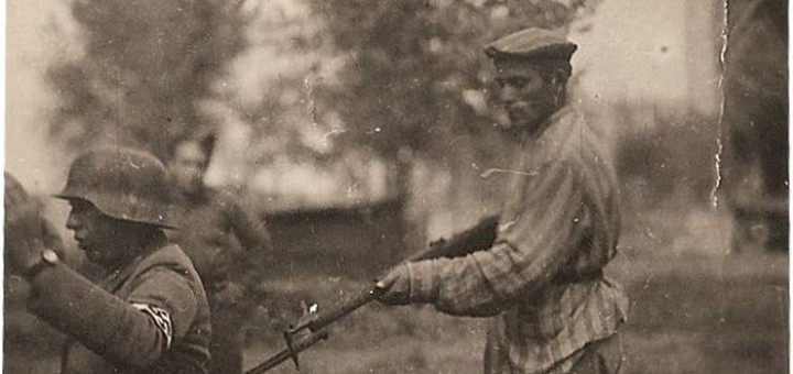 Liberated prisoner holds Nazi at gunpoint